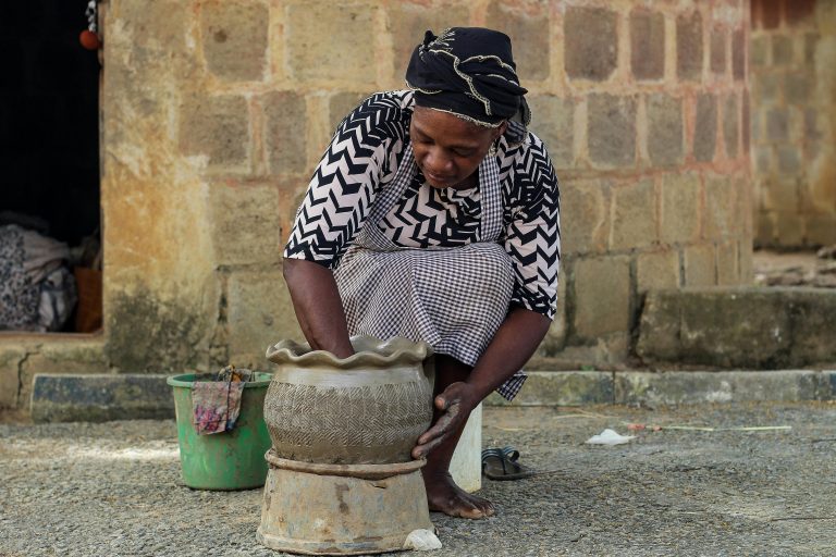 Woman making pot